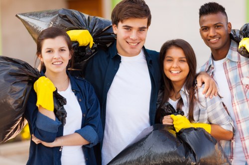 Workers preparing for a house clearance job with safety gear